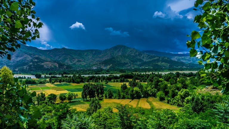 Scenic view of Kalam Valley in Pakistan with lush greenery and mountains.