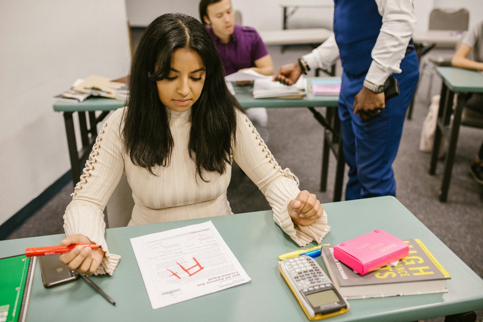 A college student is given an F grade in a classroom setting during an exam.